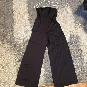 Black jumpsuit with zipper and tie belt